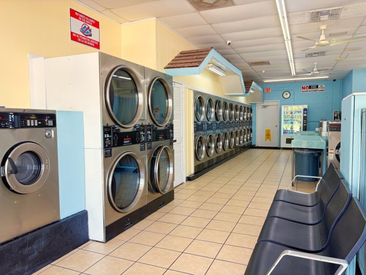 Stacked dryers and customer seating area