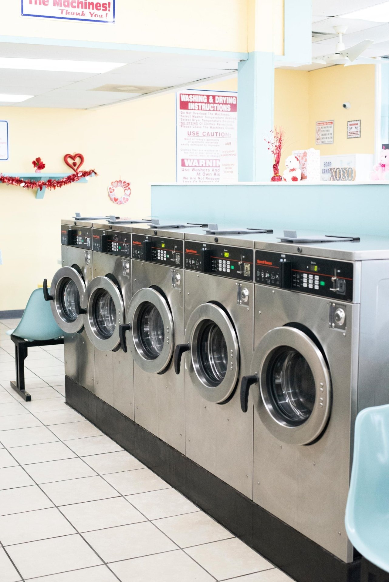 Row of front-load washers inside Bright 'N Clean Laundromat